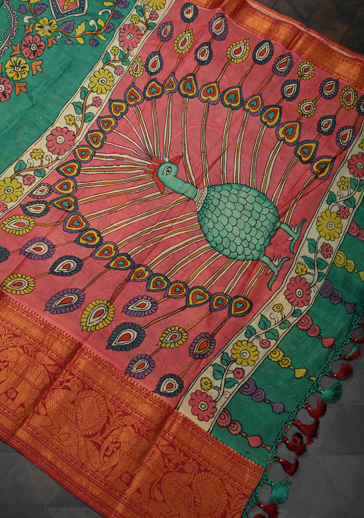 Floral and Peacock Theme : Green Authentic Pen kalamkari on Pure Chennuri Silk Saree with Wide Zari Border
