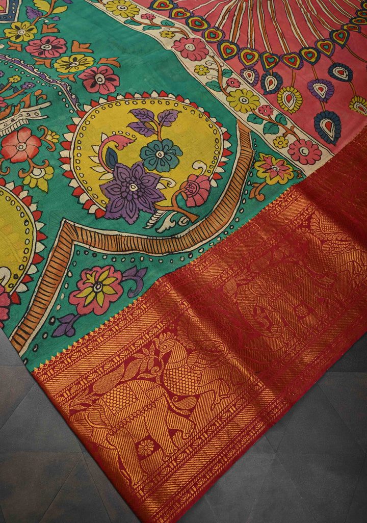 Floral and Peacock Theme : Green Authentic Pen kalamkari on Pure Chennuri Silk Saree with Wide Zari Border