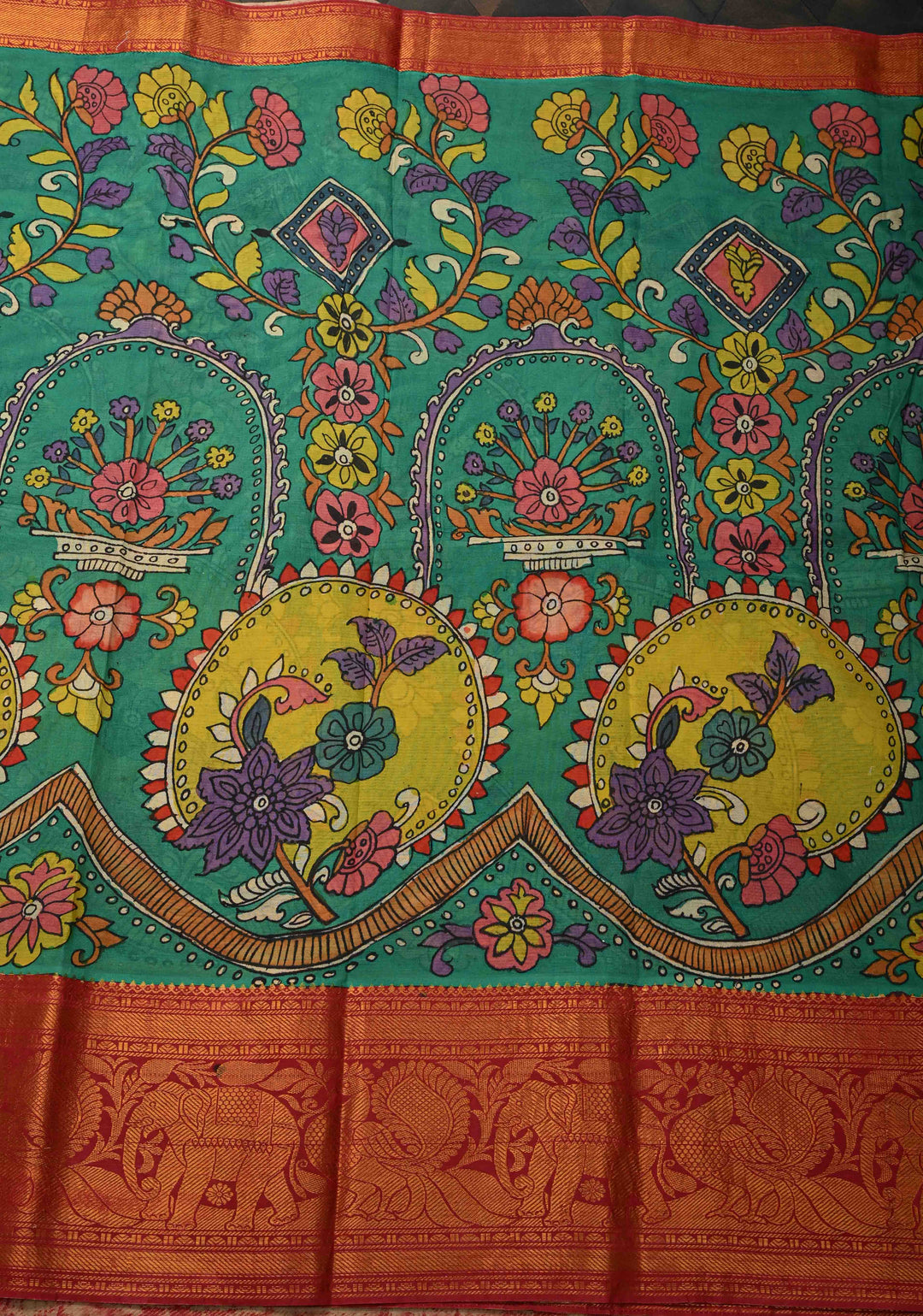 Floral and Peacock Theme : Green Authentic Pen kalamkari on Pure Chennuri Silk Saree with Wide Zari Border