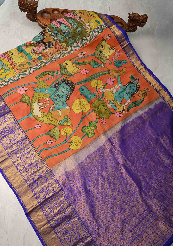 Balakrishna Pichwai Theme : Rust Orange Authentic Pen Kalamkari on Pure Kanjivaram Silk Saree with Wide Zari Border | SILK MARK CERTIFIED
