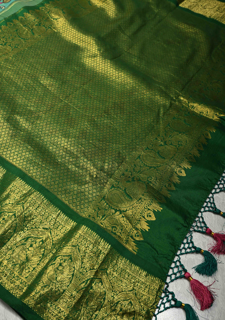 Nari Shakti and Floral Theme  : Turquoise Authentic Pen Kalamkari on Pure Kanjivaram Silk Saree with Bottle Green Zari Border | SILK MARK CERTIFIED