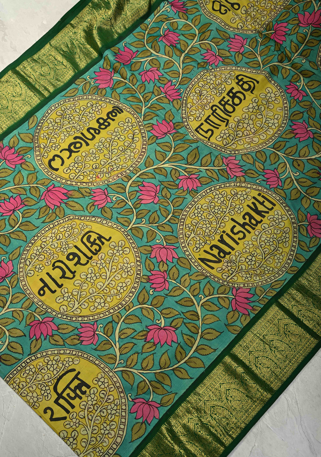 Nari Shakti and Floral Theme  : Turquoise Authentic Pen Kalamkari on Pure Kanjivaram Silk Saree with Bottle Green Zari Border | SILK MARK CERTIFIED