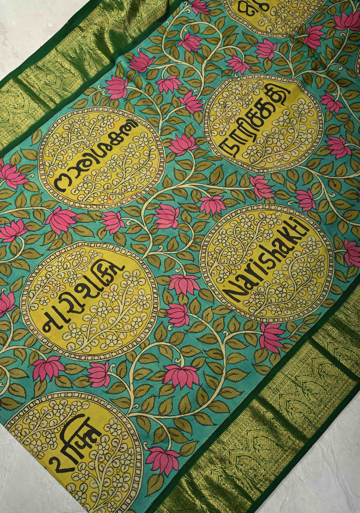 Nari Shakti and Floral Theme  : Turquoise Authentic Pen Kalamkari on Pure Kanjivaram Silk Saree with Bottle Green Zari Border | SILK MARK CERTIFIED