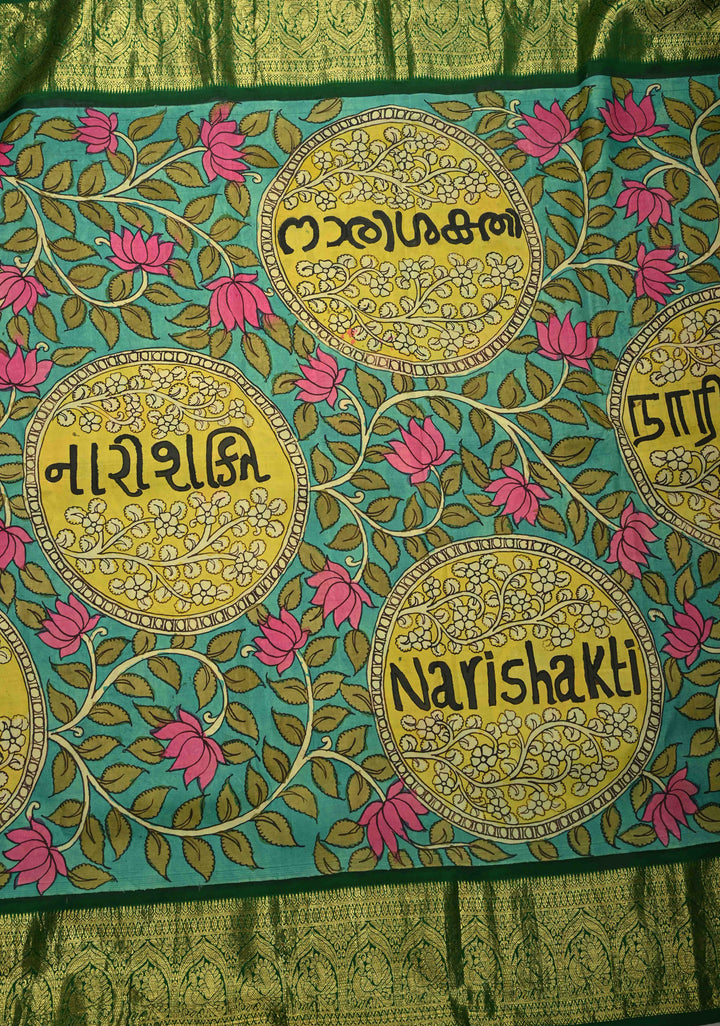 Nari Shakti and Floral Theme  : Turquoise Authentic Pen Kalamkari on Pure Kanjivaram Silk Saree with Bottle Green Zari Border | SILK MARK CERTIFIED