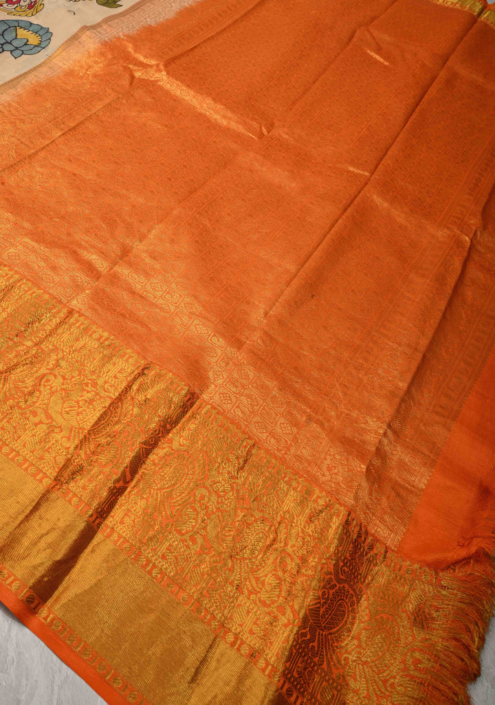 Matsya Theme :  Beige Authentic Pen Kalamkari on Pure Kanjivaram Silk Saree with Contrast Orange Zari Border | SILK MARK CERTIFIED