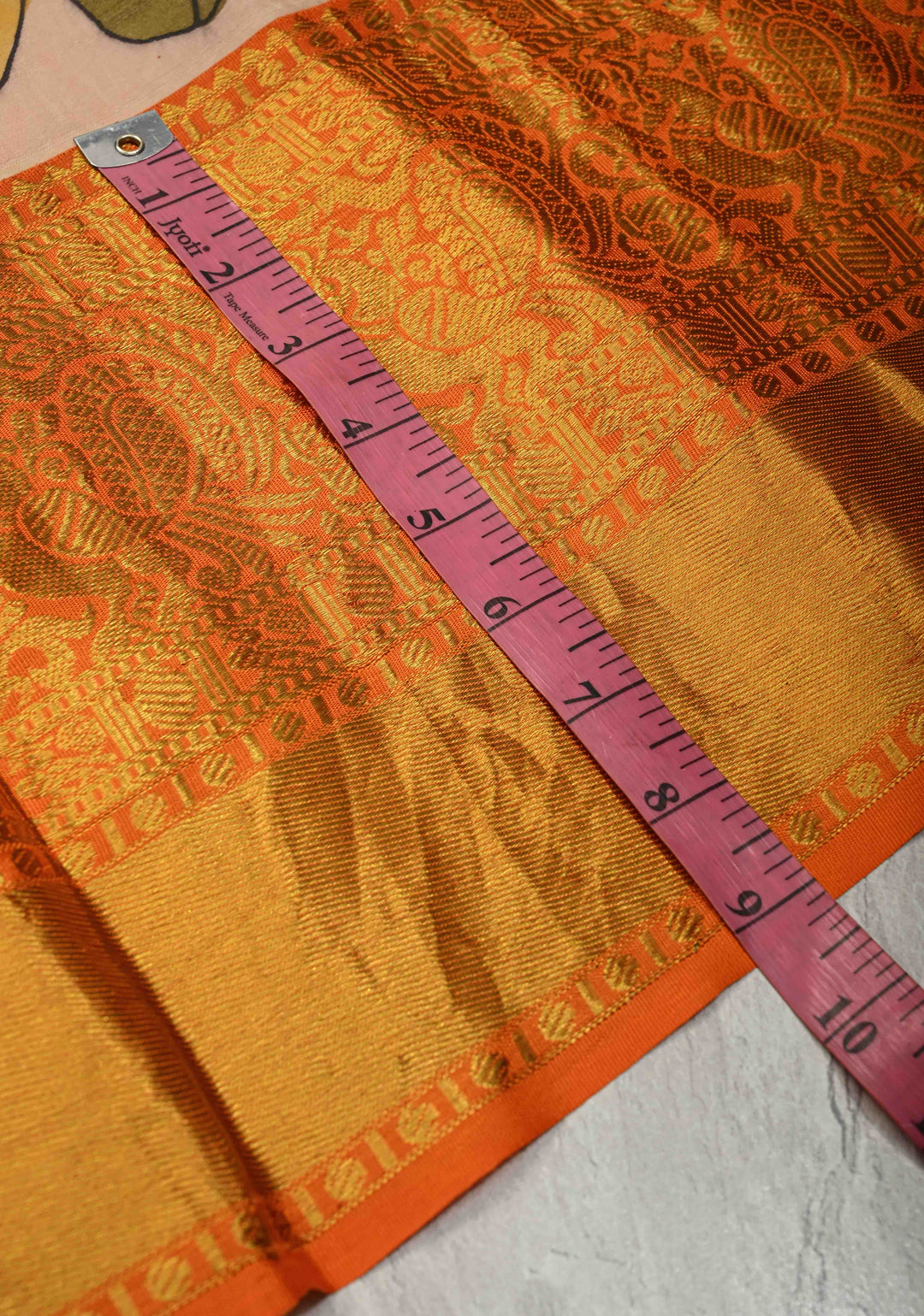 Matsya Theme :  Beige Authentic Pen Kalamkari on Pure Kanjivaram Silk Saree with Contrast Orange Zari Border | SILK MARK CERTIFIED