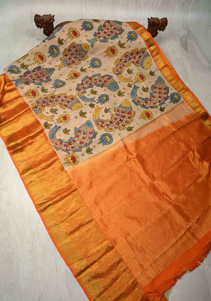 Matsya Theme :  Beige Authentic Pen Kalamkari on Pure Kanjivaram Silk Saree with Contrast Orange Zari Border | SILK MARK CERTIFIED