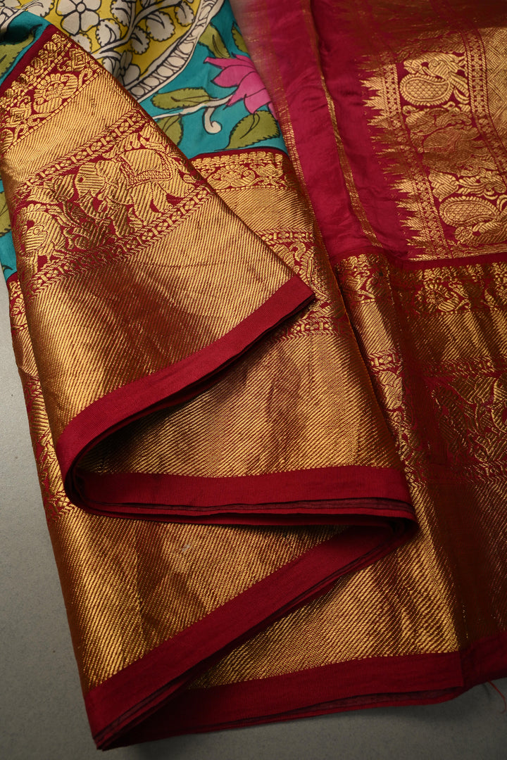 Nari Shakti and Floral Theme  : Turquoise Blue Authentic Pen Kalamkari on Pure Kanjivaram Silk Saree with Deep Maroon Zari Border | SILK MARK CERTIFIED | SHOBITAM
