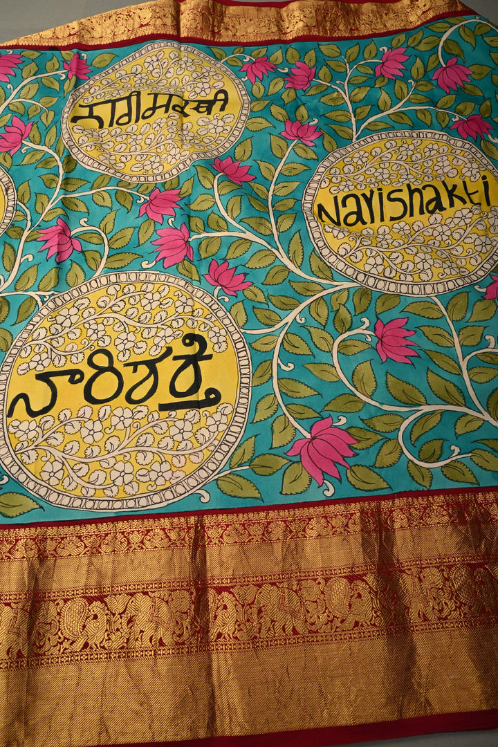 Nari Shakti and Floral Theme  : Turquoise Blue Authentic Pen Kalamkari on Pure Kanjivaram Silk Saree with Deep Maroon Zari Border | SILK MARK CERTIFIED | SHOBITAM