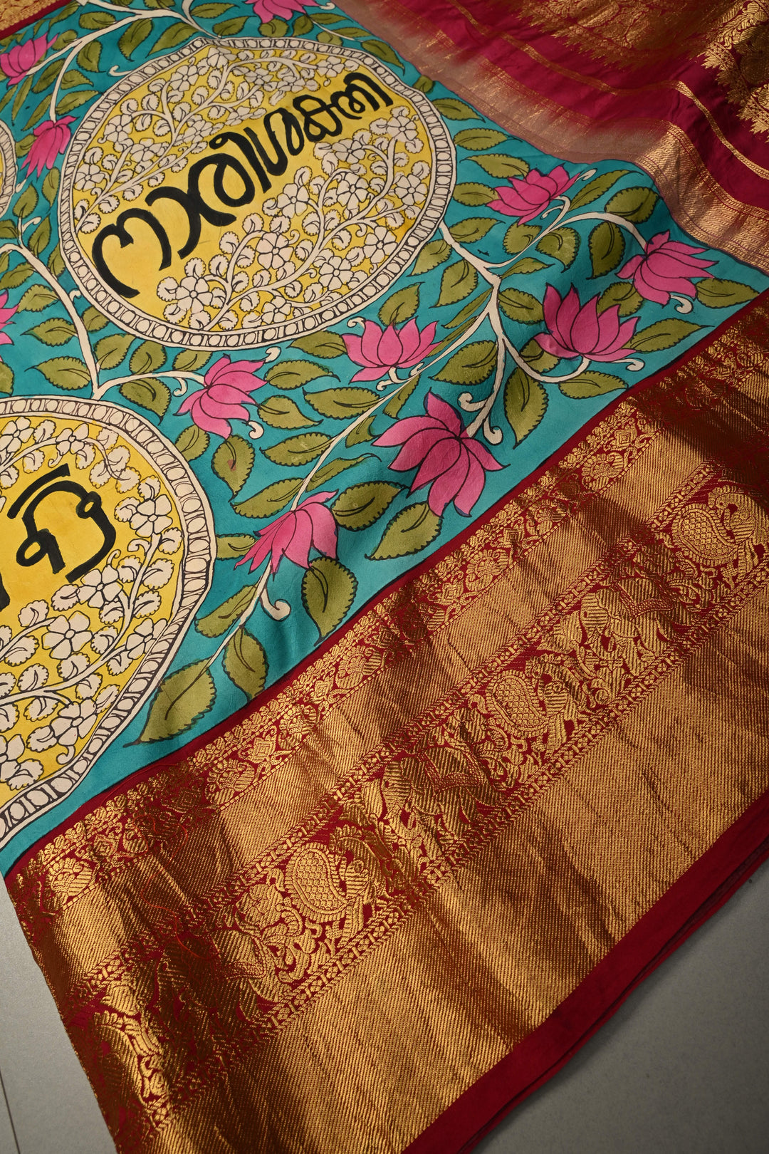 Nari Shakti and Floral Theme  : Turquoise Blue Authentic Pen Kalamkari on Pure Kanjivaram Silk Saree with Deep Maroon Zari Border | SILK MARK CERTIFIED | SHOBITAM