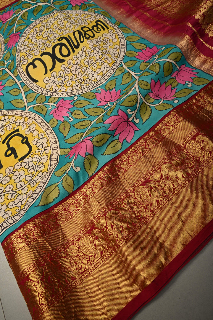 Nari Shakti and Floral Theme  : Turquoise Blue Authentic Pen Kalamkari on Pure Kanjivaram Silk Saree with Deep Maroon Zari Border | SILK MARK CERTIFIED | SHOBITAM