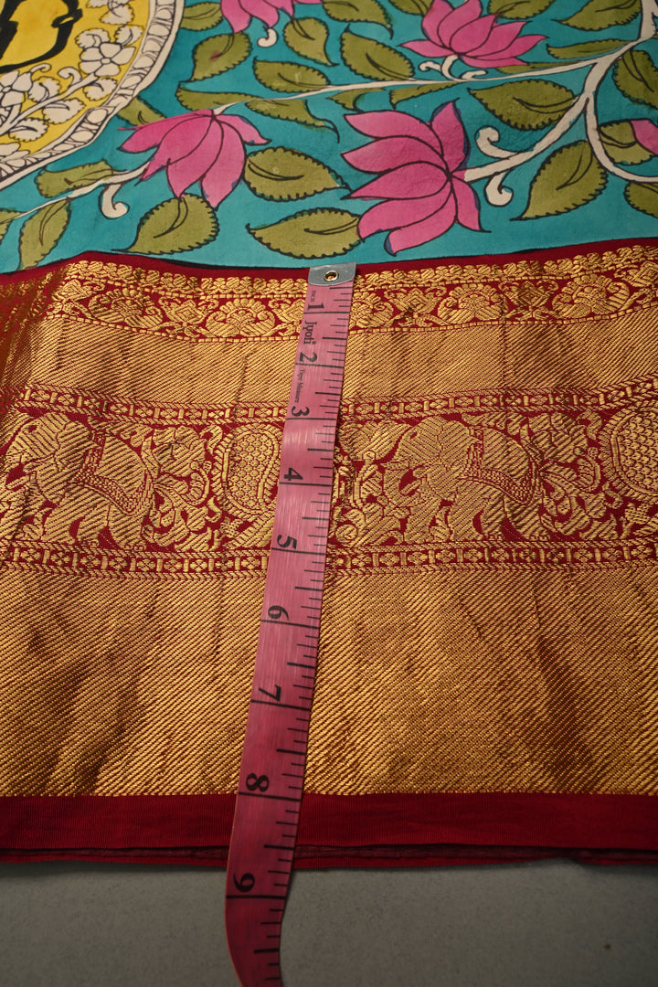 Nari Shakti and Floral Theme  : Turquoise Blue Authentic Pen Kalamkari on Pure Kanjivaram Silk Saree with Deep Maroon Zari Border | SILK MARK CERTIFIED | SHOBITAM