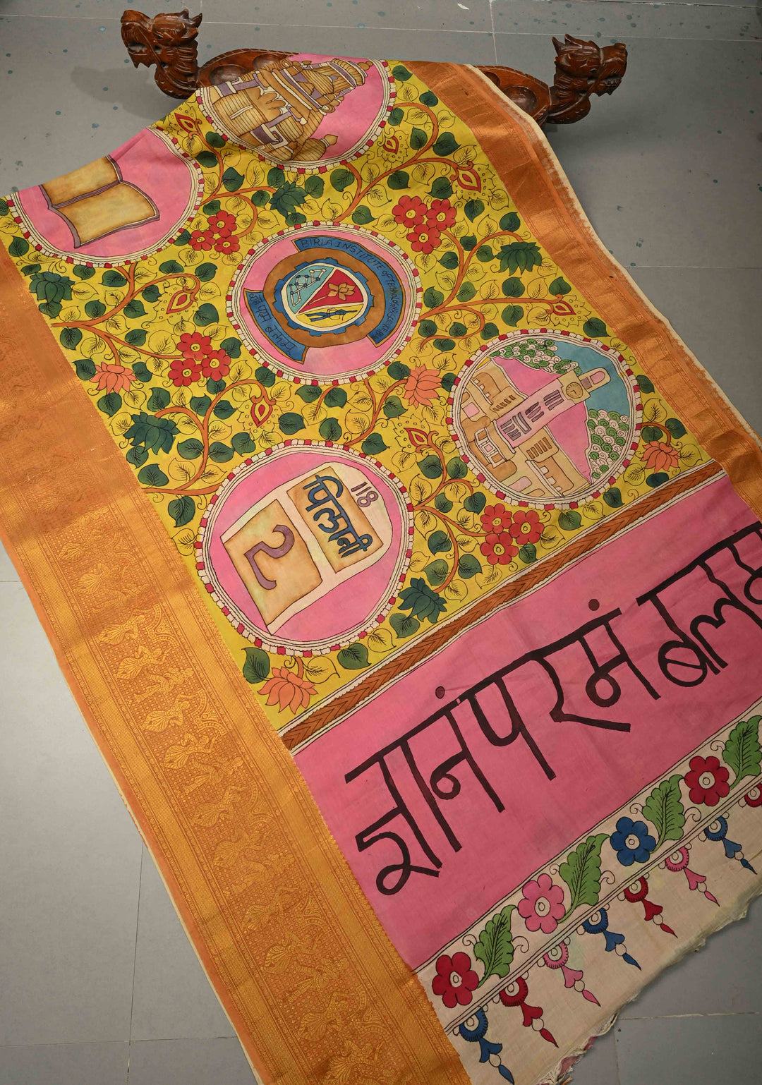 Pilani Campus Life Theme: Yellow Authentic Pen kalamkari on Bangalore Silk Saree with Zari Border and Jnanam Paramam Balam on Pallu | SHOBITAM