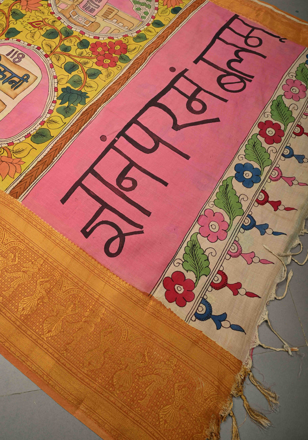 Pilani Campus Life Theme: Yellow Authentic Pen kalamkari on Bangalore Silk Saree with Zari Border and Jnanam Paramam Balam on Pallu | SHOBITAM
