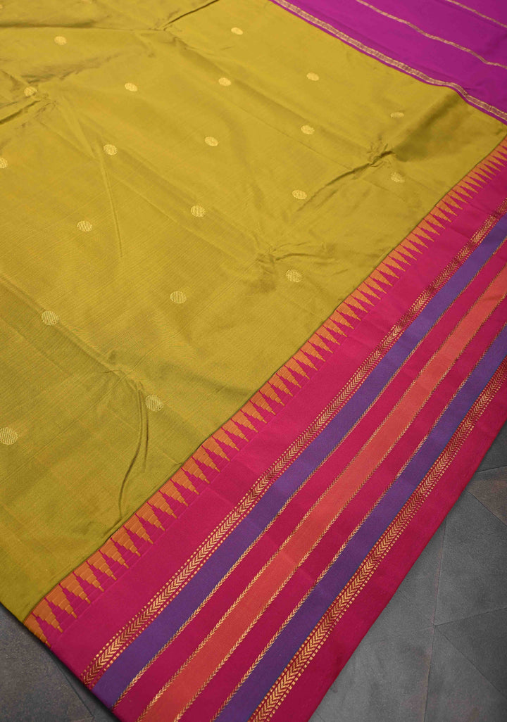 Semi Silk Saree in Moss Green with Zari Buttas And Temple borders