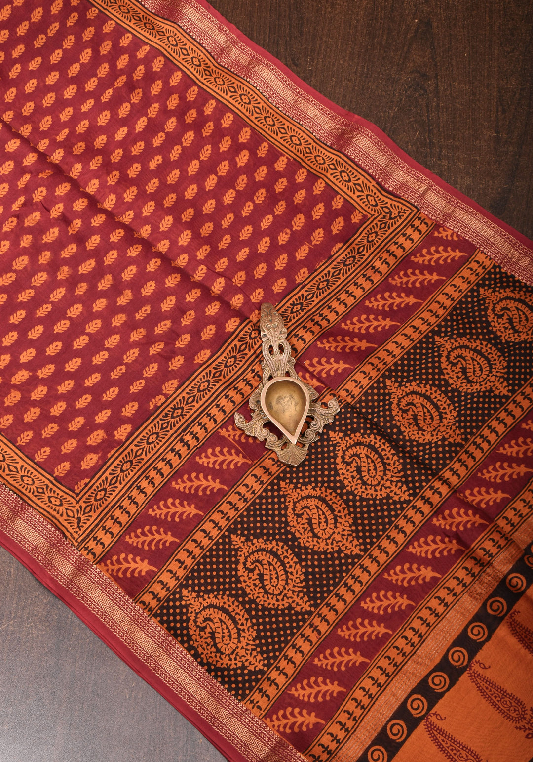 Bagh Print on Handwoven Maheshwari Silk Cotton Saree in red with minimal zari borders