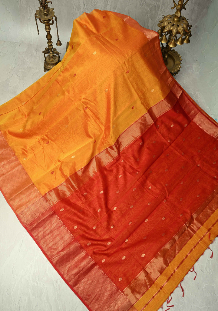 Yellowish Orange Dual Tone Handwoven Maheshwari Silk Cotton Saree with Resham Buttas and Contrast Border