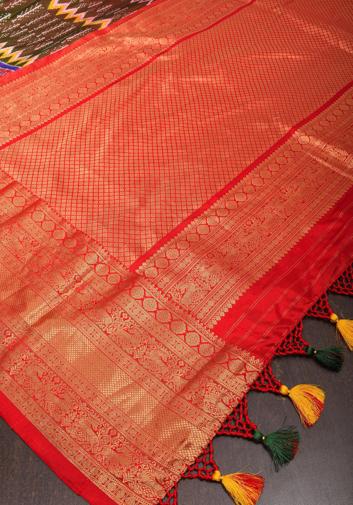 Unique Henna Green-Red dual tone  Ikkat Patola Kanjivaram Fusion Silk Saree with Panel design and zari border | SILK MARK CERTIFIED
