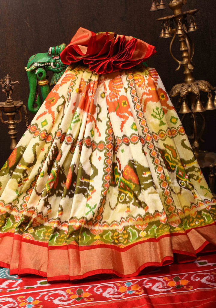 Ivory Lime Ikkat Pure Silk Saree with Jungle Inspired Motifs and Contrast Red border I SILK MARK CERTIFIED