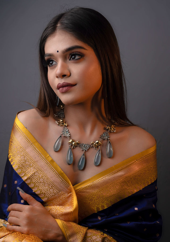 Fusion Dual Tone Jewelry with Pichwai Cow Units and Heather Blue Stones | Shobitam Jewelry