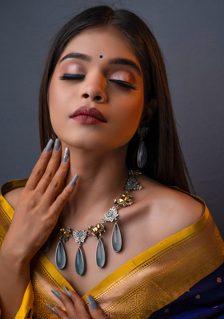 Fusion Dual Tone Jewelry with Pichwai Cow Units and Heather Blue Stones | Shobitam Jewelry