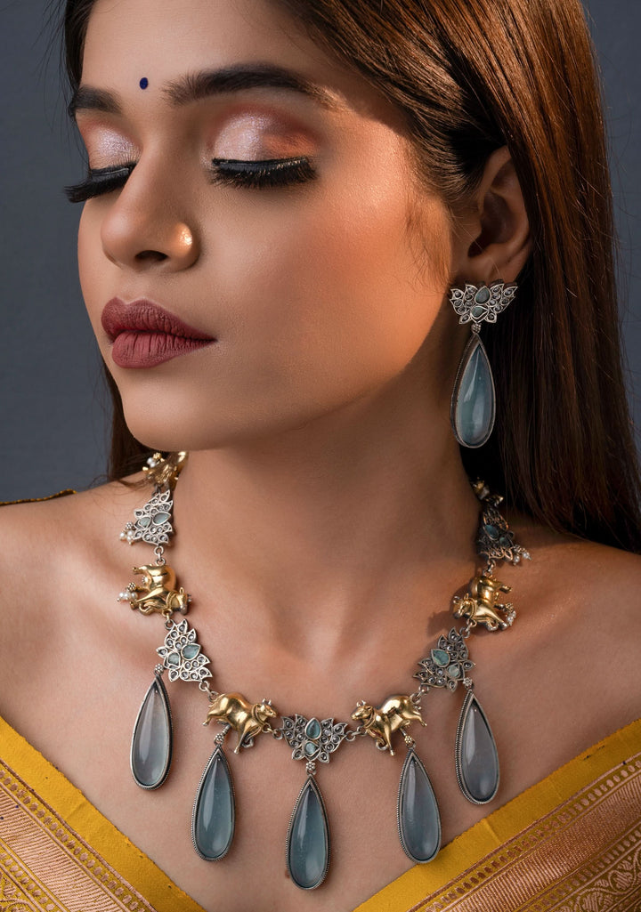 Fusion Dual Tone Jewelry with Pichwai Cow Units and Heather Blue Stones | Shobitam Jewelry