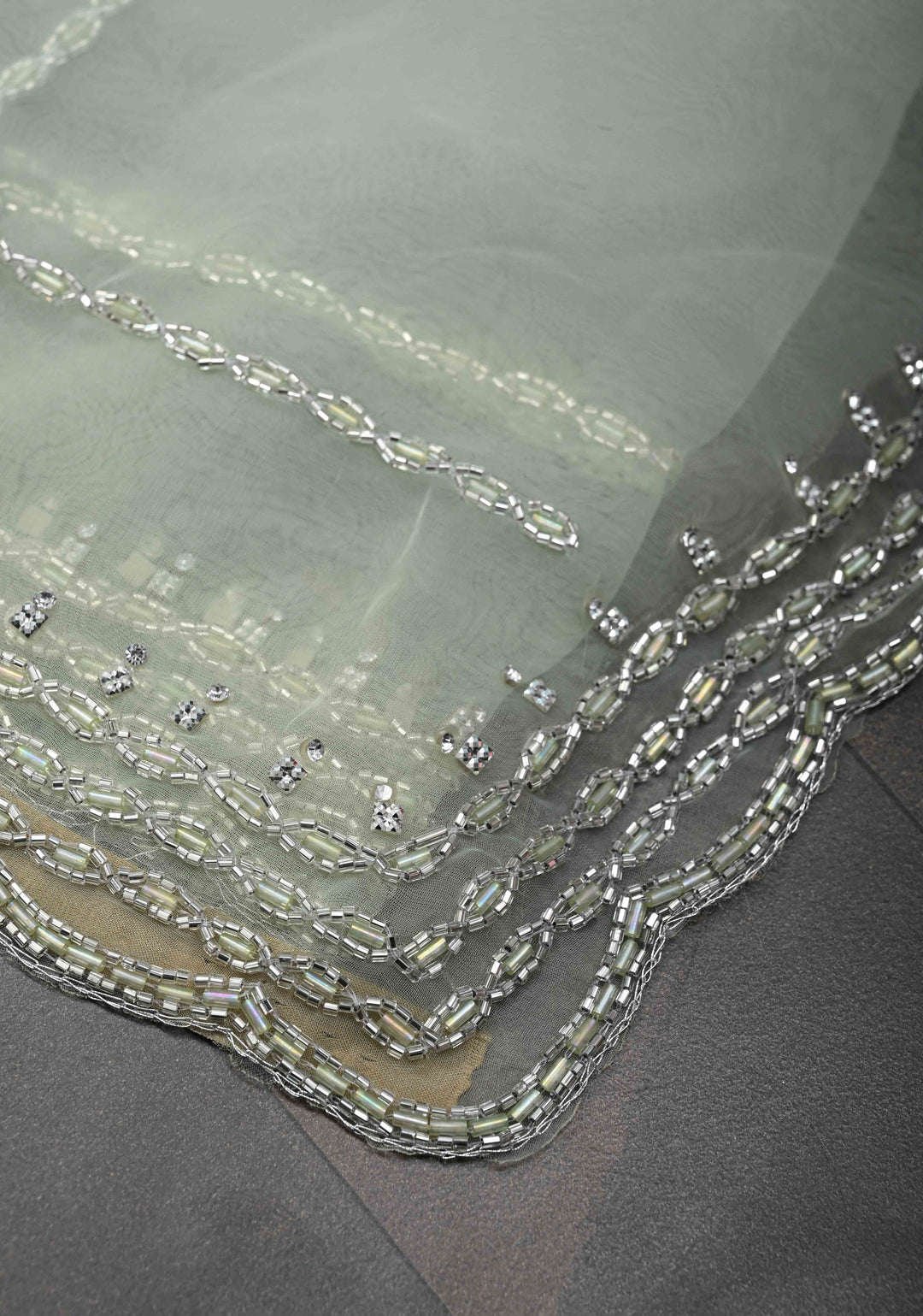 Dewy Pista Green Organza Saree with Horizontal Stripes Cutdana and Beads Embroidery Scallop Border