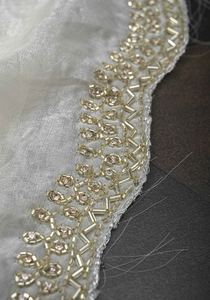 Ivory Shimmer Georgette Saree with Cutdana and  Stone Work embellishments