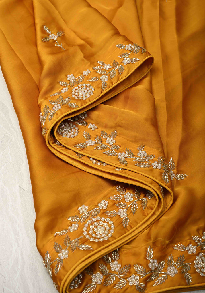 Mustard Yellow  Satin Georgette saree with moti, cutdana and Zardozi embellishments
