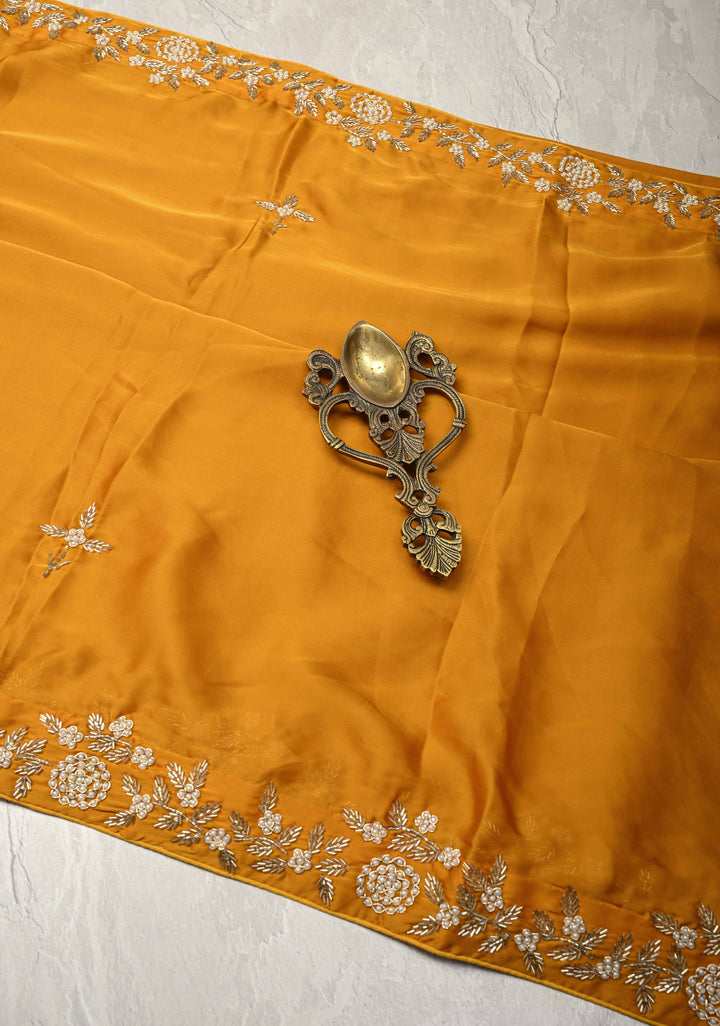 Mustard Yellow  Satin Georgette saree with moti, cutdana and Zardozi embellishments