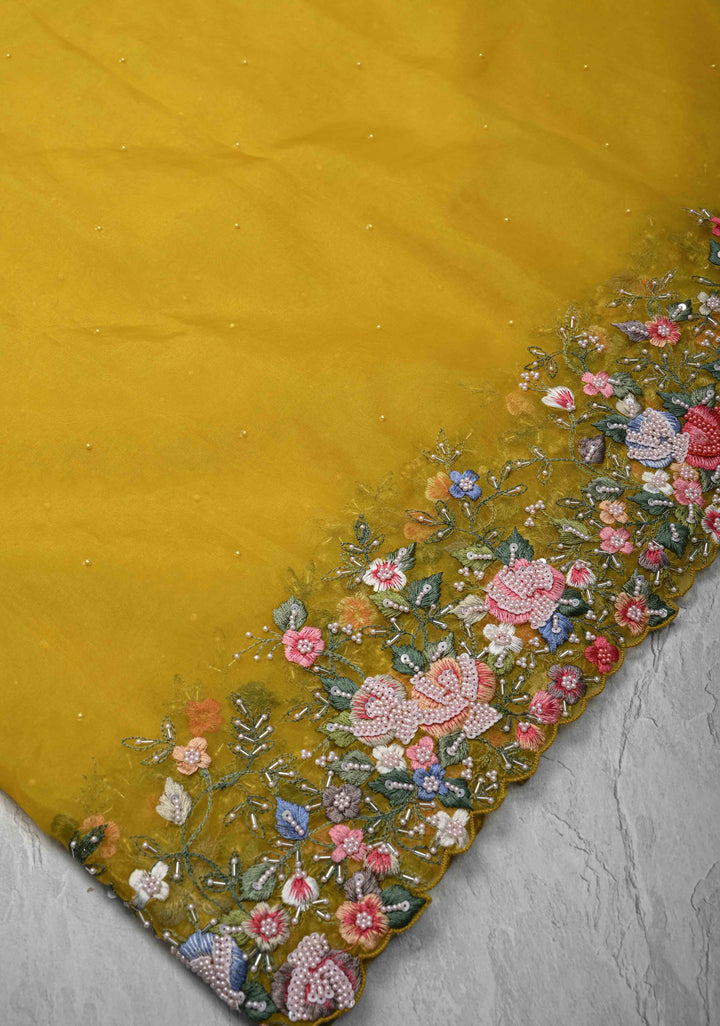 Mustard Yellow Moti work on Organza Saree with sequins, cutdana and Resham Hand Embroidery on Scallop Border