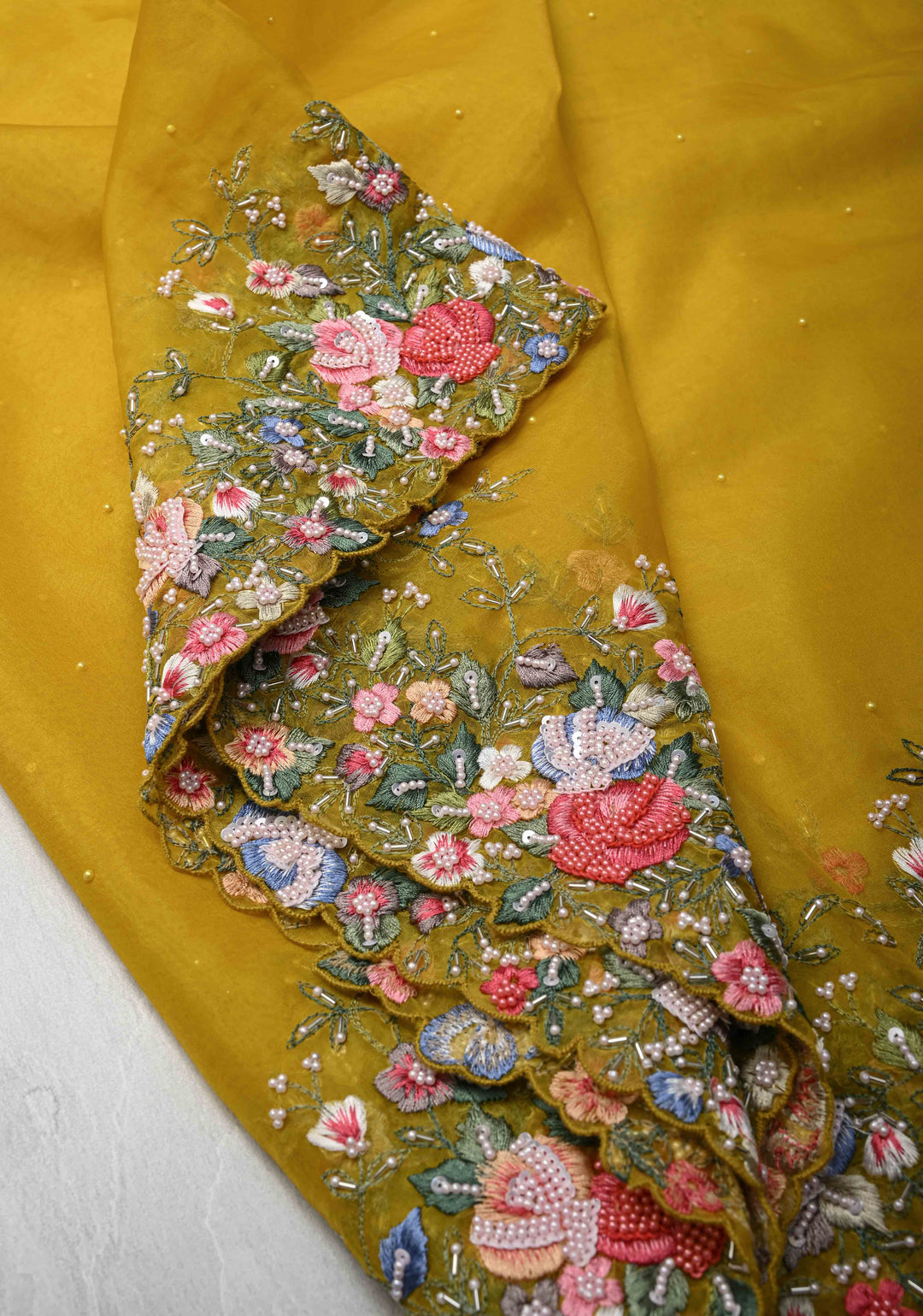 Mustard Yellow Moti work on Organza Saree with sequins, cutdana and Resham Hand Embroidery on Scallop Border