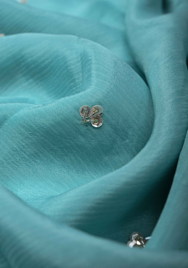 Sky Blue Floral Jaal on Crushed Georgette Saree with Sequins, Cutwork border, Moti Embellishment and Scallop Border