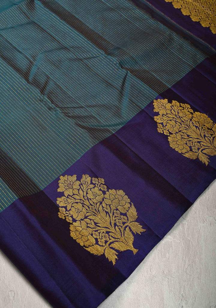 Dark Teal Pure Kanjivaram Silk Handloom Saree with Vairaoosi Zari Stripes and Distinct Floral Motofs on Contrast Border  | SILK MARK CERTIFIED