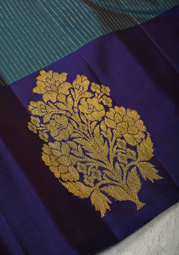 Dark Teal Pure Kanjivaram Silk Handloom Saree with Vairaoosi Zari Stripes and Distinct Floral Motofs on Contrast Border  | SILK MARK CERTIFIED