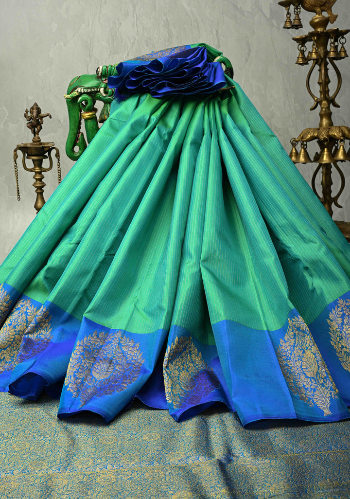 Sea Green Dual tone Pure Kanjivaram Silk Handloom Saree with Vairaoosi Zari Stripes and Distinct Floral Motifs on Contrast Border  | SILK MARK CERTIFIED