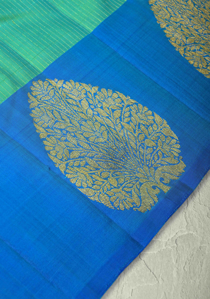 Sea Green Dual tone Pure Kanjivaram Silk Handloom Saree with Vairaoosi Zari Stripes and Distinct Tree Motifs on Contrast Border  | SILK MARK CERTIFIED