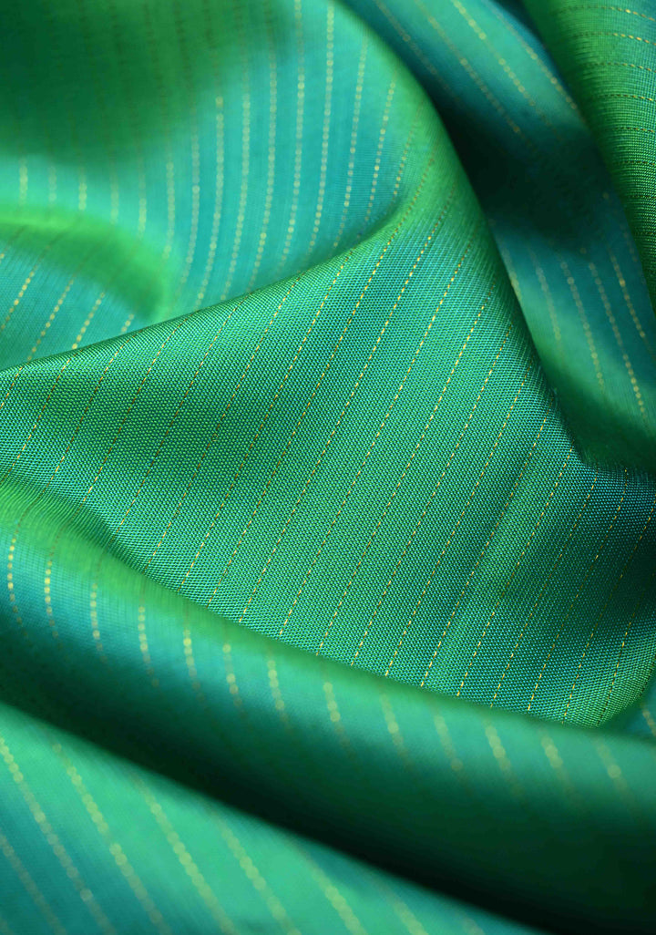 Sea Green Dual tone Pure Kanjivaram Silk Handloom Saree with Vairaoosi Zari Stripes and Distinct Tree Motifs on Contrast Border  | SILK MARK CERTIFIED
