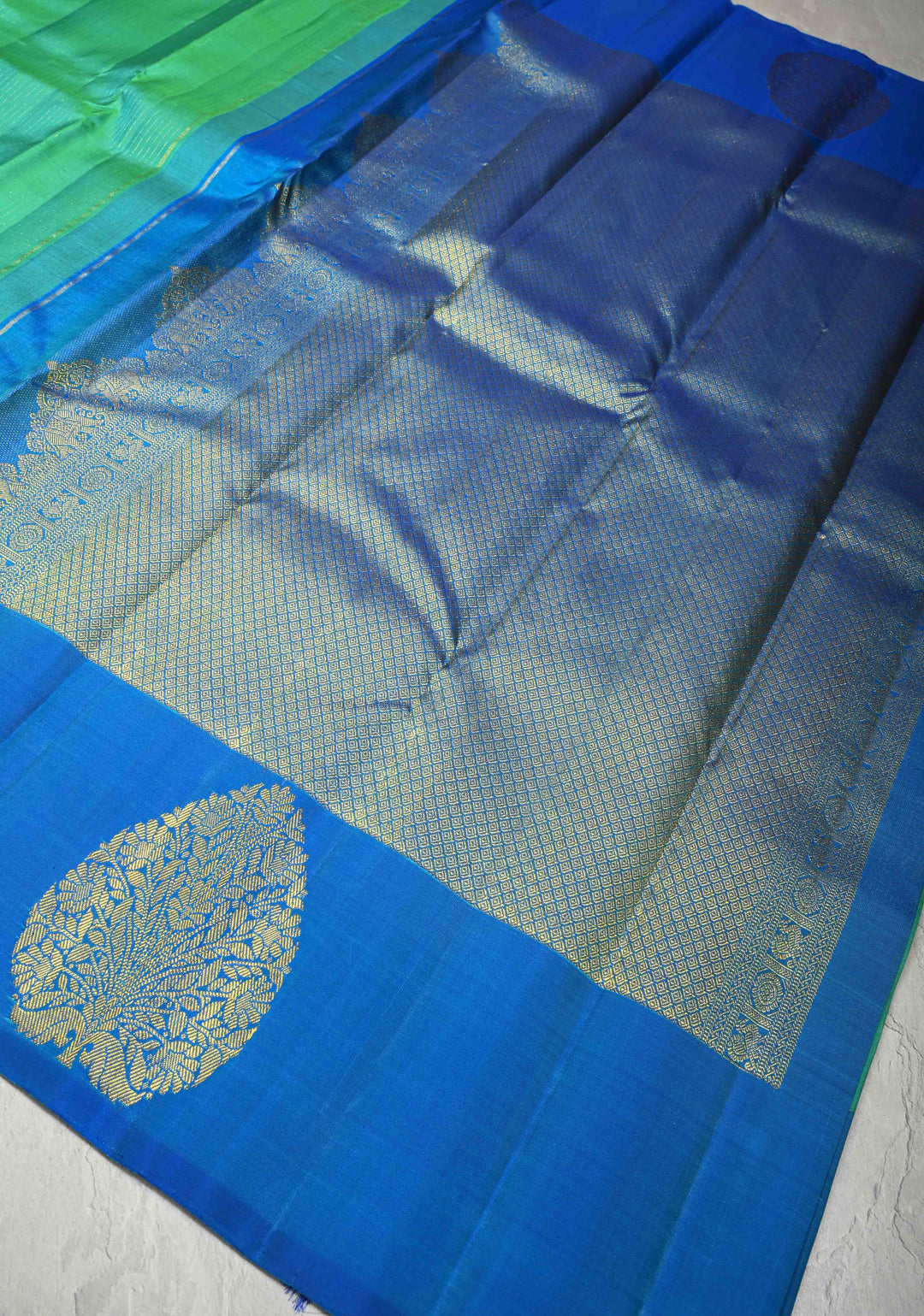 Green-Blue Dual Tone Pure Kanjivaram Silk Handloom Saree with Vairaoosi Zari Stripes and Distinct Floral Motifs on Contrast Border | SILK MARK CERTIFIED