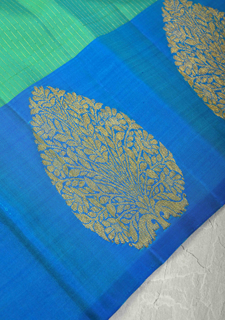 Green-Blue Dual Tone Pure Kanjivaram Silk Handloom Saree with Vairaoosi Zari Stripes and Distinct Floral Motifs on Contrast Border | SILK MARK CERTIFIED