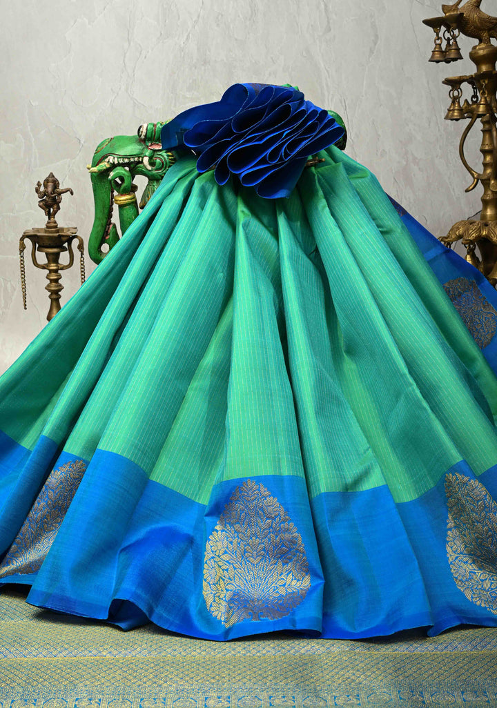 Green-Blue Dual Tone Pure Kanjivaram Silk Handloom Saree with Vairaoosi Zari Stripes and Distinct Floral Motifs on Contrast Border | SILK MARK CERTIFIED