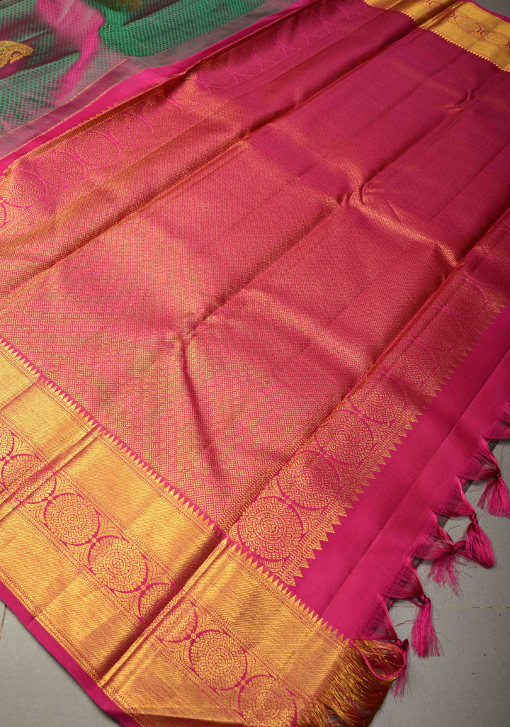 Magenta-Emerald Green Dual Tone Self Brocade on Pure Kanjivaram Saree with Paisley Motifs and Zari Border | SILK MARK CERTIFIED