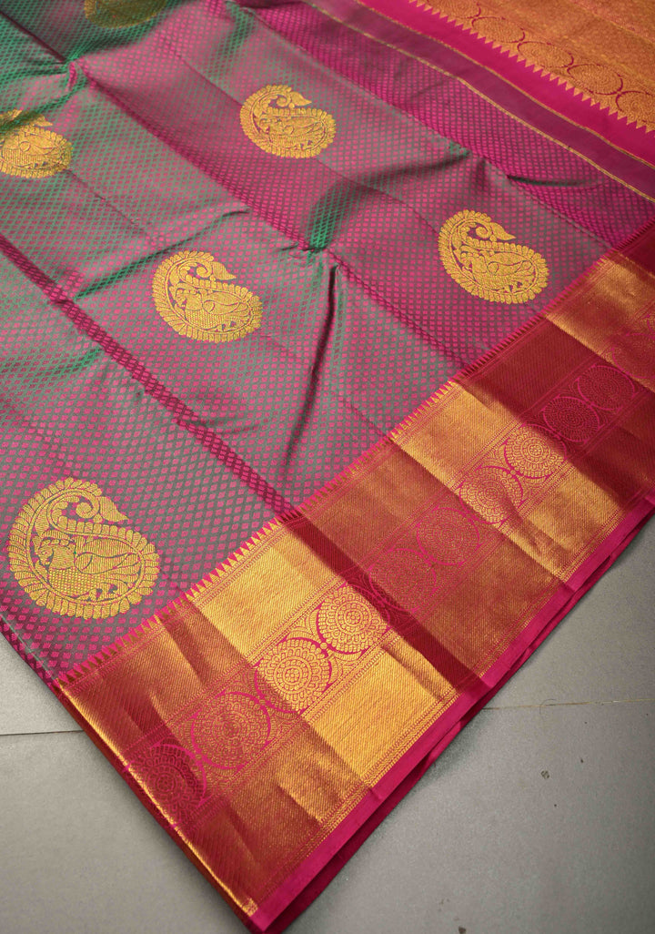 Magenta-Emerald Green Dual Tone Self Brocade on Pure Kanjivaram Saree with Paisley Motifs and Zari Border | SILK MARK CERTIFIED