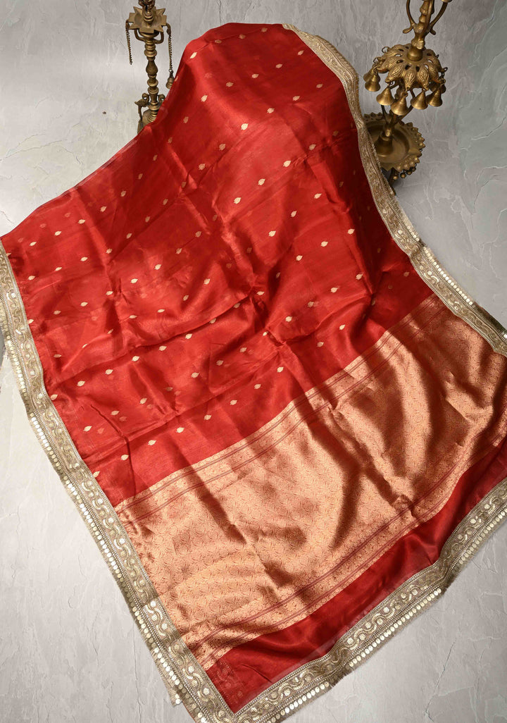 Orangish Red Organza Tissue Silk Saree with Kadhuwa Zari Buttas and Fancy Lace Trim Border | SILK MARK CERTIFIED