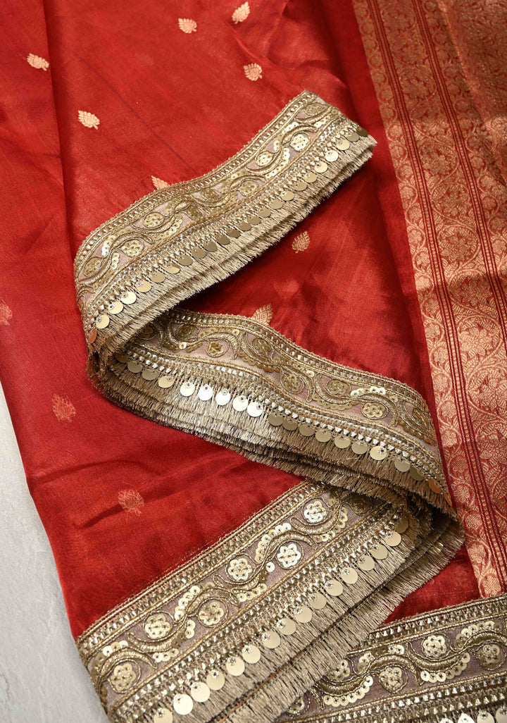 Orangish Red Organza Tissue Silk Saree with Kadhuwa Zari Buttas and Fancy Lace Trim Border | SILK MARK CERTIFIED