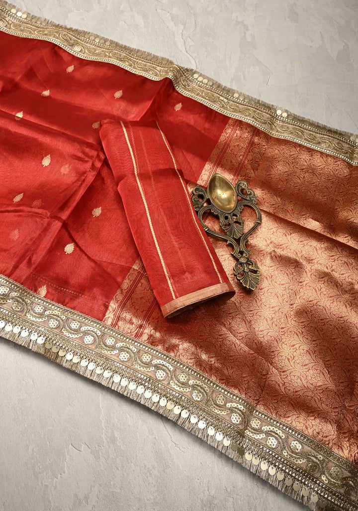 Orangish Red Organza Tissue Silk Saree with Kadhuwa Zari Buttas and Fancy Lace Trim Border | SILK MARK CERTIFIED