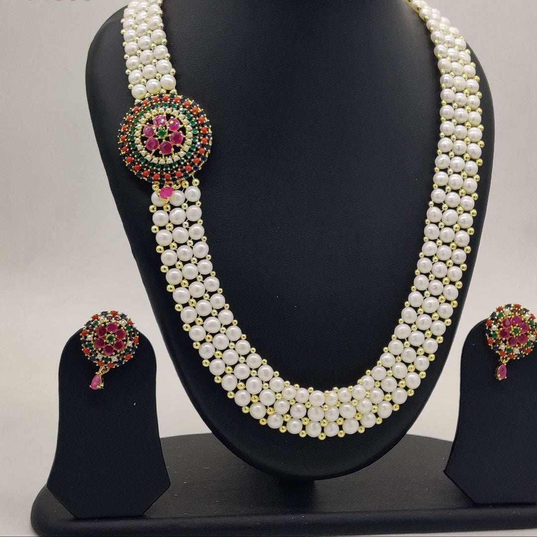 Multi-layered pearl necklace with a large circular pendant Pearls Broach Set | SHOBITAM