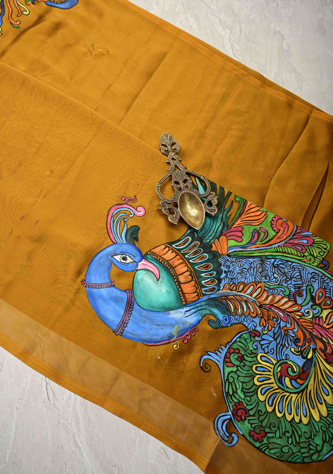 Ochre yellow on Shimmer Georgette Saree with Hand paint Peacock Motifs