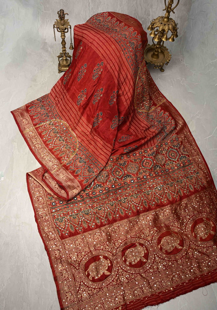 Red Ajrakh Hand Block Print on Dola Silk Saree with Cutdana-Sequins and Mirror Work Hand embroidery
