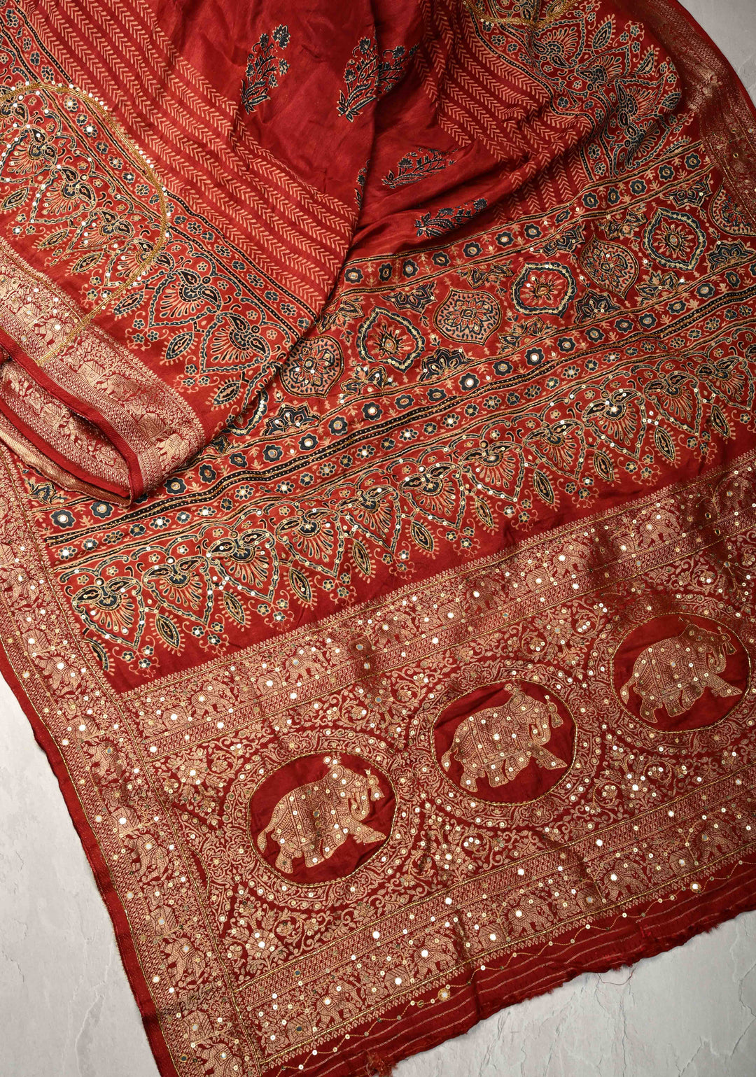 Red Ajrakh Hand Block Print on Dola Silk Saree with Cutdana-Sequins and Mirror Work Hand embroidery